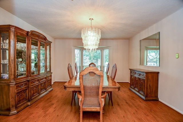 11103 Pembridge Dr, Houston, TX 77071 - dining room with a chandelier and wood finished floors