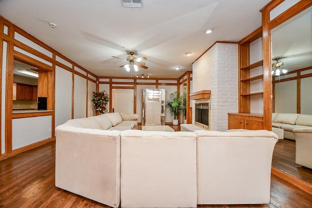 11103 Pembridge Dr, Houston, TX 77071 - living room featuring ceiling fan, dark wood-style floors, and a fireplace