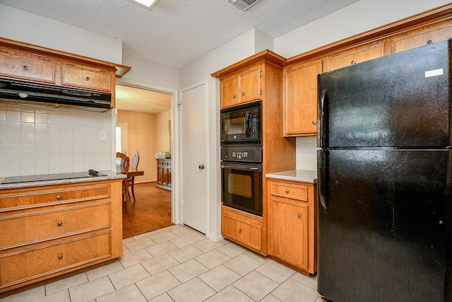 11103 Pembridge Dr, Houston, TX 77071 - kitchen featuring black appliances, exhaust hood, tasteful backsplash, brown cabinets, and light tile patterned flooring