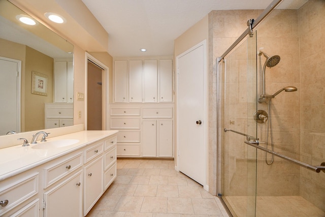 11103 Pembridge Dr, Houston, TX 77071 - bathroom with a stall shower, vanity, recessed lighting, and tile patterned floors