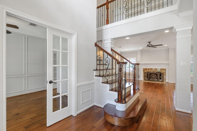 15902 Ivy Bridge Ln, Houston, TX 77095 - stairway with a ceiling fan, a decorative wall, decorative columns, wood-type flooring, and french doors