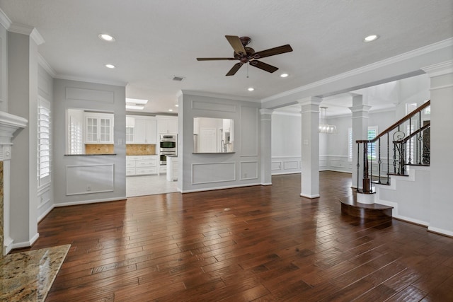 15902 Ivy Bridge Ln, Houston, TX 77095 - unfurnished living room with a ceiling fan, dark wood finished floors, decorative columns, recessed lighting, and a decorative wall