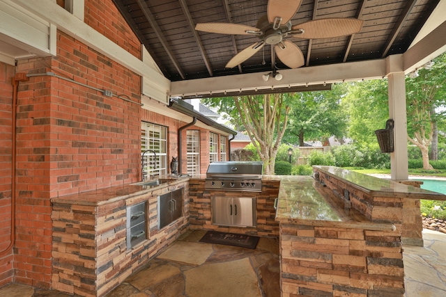 15902 Ivy Bridge Ln, Houston, TX 77095 - view of patio with an outdoor kitchen and a ceiling fan