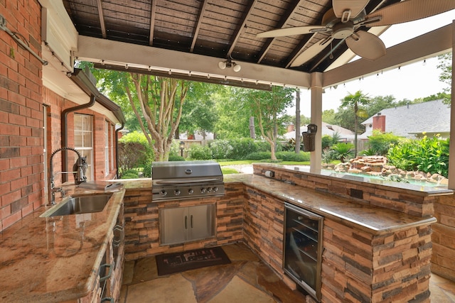 15902 Ivy Bridge Ln, Houston, TX 77095 - view of patio with beverage cooler, a ceiling fan, and an outdoor kitchen