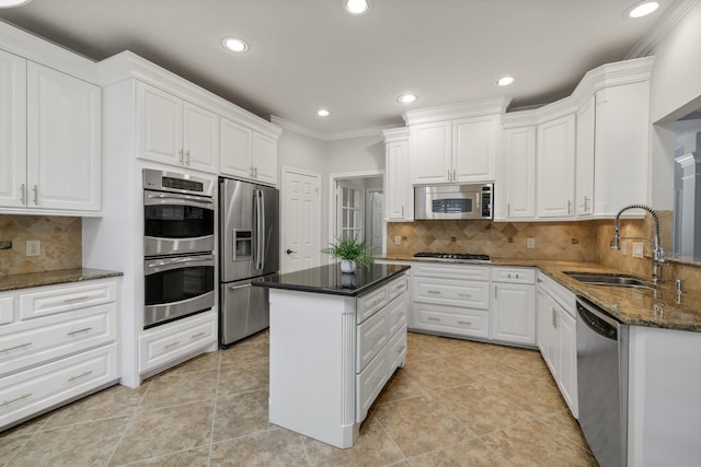 15902 Ivy Bridge Ln, Houston, TX 77095 - kitchen featuring stainless steel appliances, recessed lighting, white cabinets, crown molding, and backsplash
