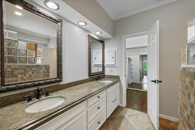 15902 Ivy Bridge Ln, Houston, TX 77095 - bathroom featuring crown molding, healthy amount of natural light, and double vanity