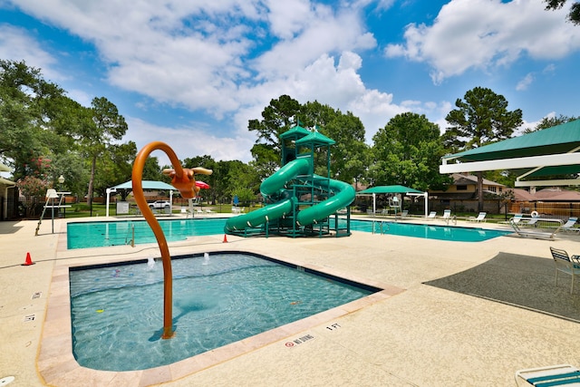 15902 Ivy Bridge Ln, Houston, TX 77095 - community pool with a water slide and a patio