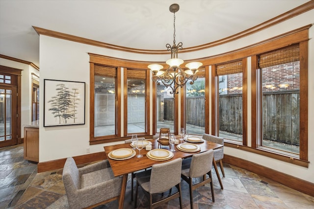 4132 Coleridge St, Houston, TX 77005 - dining space featuring ornamental molding, stone tile flooring, a chandelier, and healthy amount of natural light