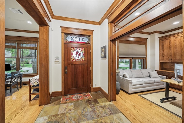 4132 Coleridge St, Houston, TX 77005 - entryway with crown molding, healthy amount of natural light, and light wood-style flooring