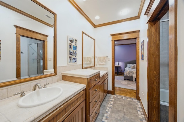 4132 Coleridge St, Houston, TX 77005 - ensuite bathroom with ornamental molding, vanity, a shower, and inlaid floor details