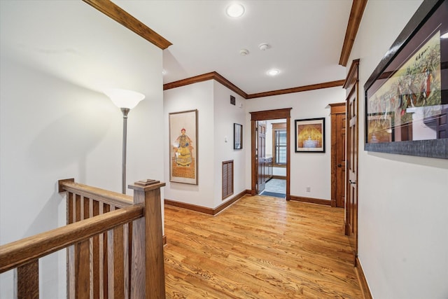 4132 Coleridge St, Houston, TX 77005 - hall featuring light wood finished floors, recessed lighting, ornamental molding, and an upstairs landing
