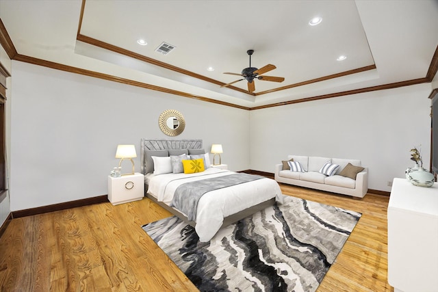 4132 Coleridge St, Houston, TX 77005 - bedroom with a tray ceiling, ornamental molding, wood finished floors, recessed lighting, and a ceiling fan