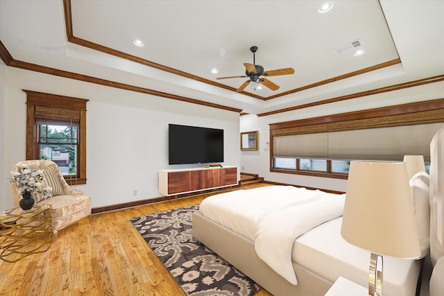 4132 Coleridge St, Houston, TX 77005 - bedroom with a tray ceiling, ornamental molding, wood finished floors, recessed lighting, and a ceiling fan