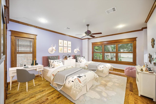 4132 Coleridge St, Houston, TX 77005 - bedroom featuring crown molding, multiple windows, light wood finished floors, and ceiling fan