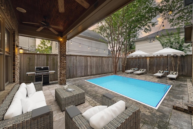 4132 Coleridge St, Houston, TX 77005 - view of swimming pool with an outdoor hangout area, a ceiling fan, a fenced backyard, area for grilling, and a patio area