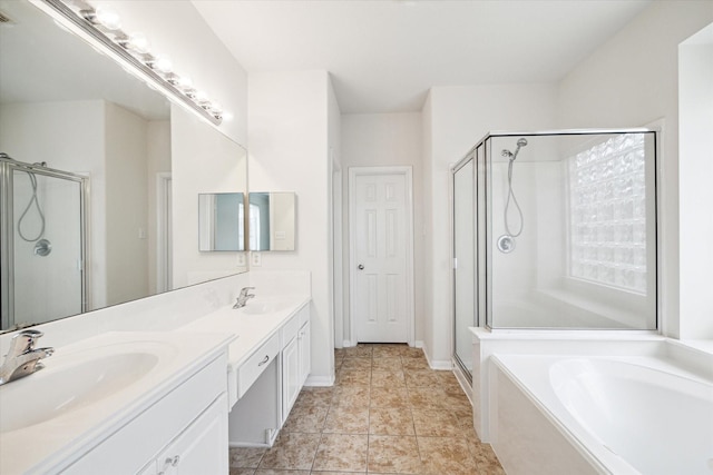 20202 Windsor Trace Ln, Richmond, TX 77407 - bathroom featuring a shower stall, double vanity, a bath, and tile patterned flooring
