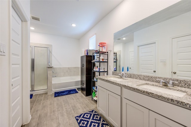 5723 Morning Vista Rd, Katy, TX 77493 - full bathroom with double vanity, a bath, a stall shower, and recessed lighting
