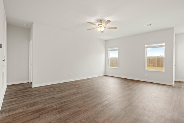 25408 Blossom Ct, Montgomery, TX 77316 - unfurnished room featuring ceiling fan and dark wood-style flooring