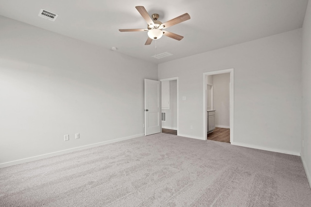 25408 Blossom Ct, Montgomery, TX 77316 - unfurnished bedroom with carpet flooring, a ceiling fan, and ensuite bath