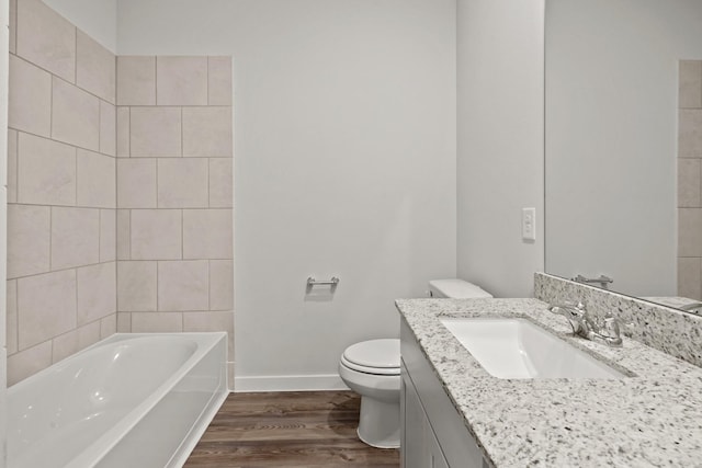 25408 Blossom Ct, Montgomery, TX 77316 - full bath featuring wood finished floors, a tub, and vanity