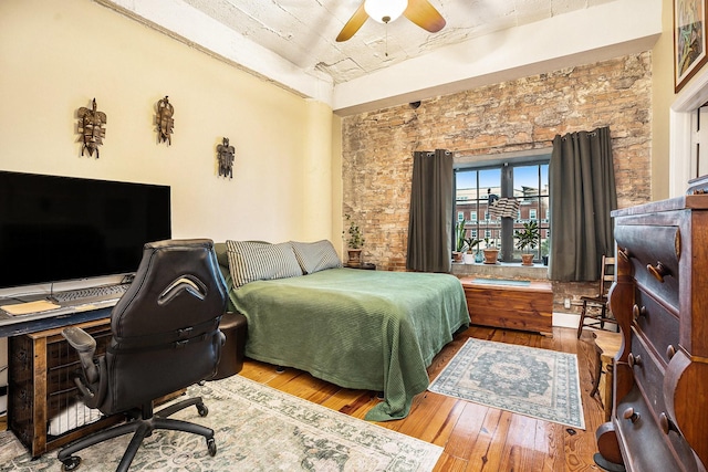 104 Moody Ave Unit 313, Galveston, TX 77550 - bedroom featuring an office area, hardwood / wood-style flooring, and a ceiling fan