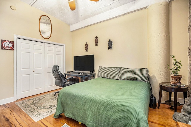 104 Moody Ave Unit 313, Galveston, TX 77550 - bedroom with wood finished floors, a closet, and ceiling fan