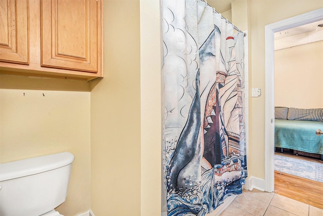 104 Moody Ave Unit 313, Galveston, TX 77550 - full bath featuring tile patterned floors and a shower with curtain