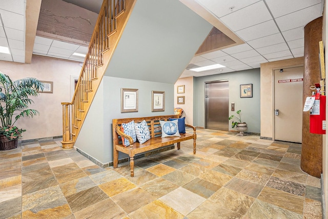 104 Moody Ave Unit 313, Galveston, TX 77550 - community lobby with a drop ceiling and stairway