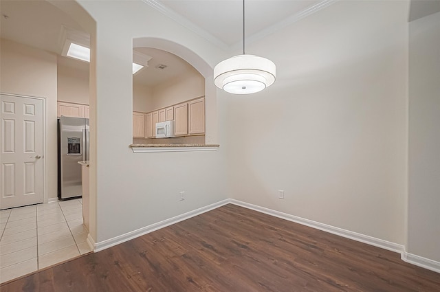 2710 Grants Lake Blvd Unit T6, Sugar Land, TX 77479 - spare room with crown molding, wood finished floors, and arched walkways
