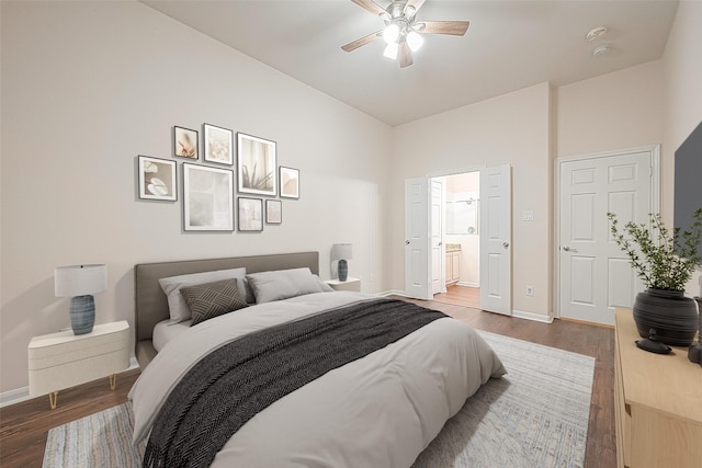 2710 Grants Lake Blvd Unit T6, Sugar Land, TX 77479 - bedroom featuring wood finished floors, ensuite bath, ceiling fan, and high vaulted ceiling