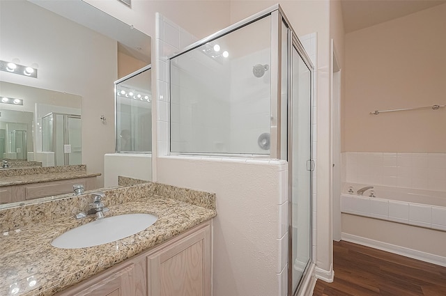 2710 Grants Lake Blvd Unit T6, Sugar Land, TX 77479 - full bathroom featuring a shower stall, vanity, wood finished floors, and a bath