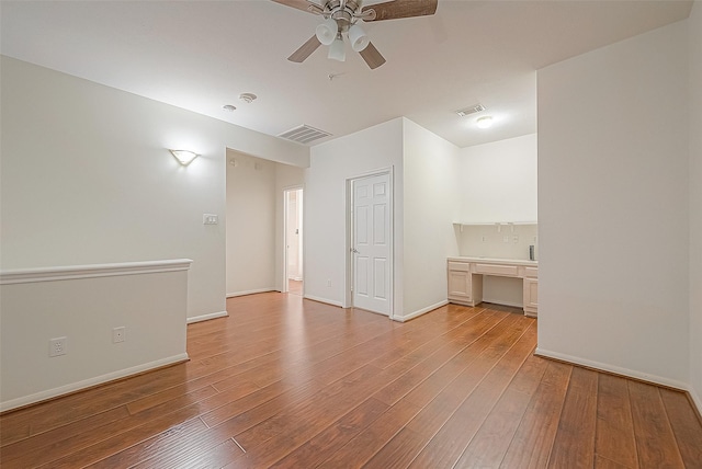 2710 Grants Lake Blvd Unit T6, Sugar Land, TX 77479 - spare room featuring built in desk, ceiling fan, and light wood finished floors