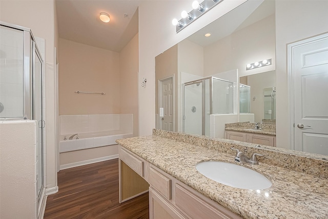 2710 Grants Lake Blvd Unit T6, Sugar Land, TX 77479 - full bathroom with a stall shower, wood finished floors, a garden tub, and vanity
