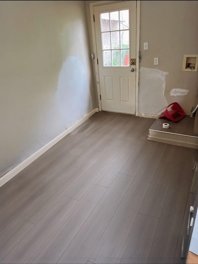 1204 Johnston St, Houston, TX 77022 - entryway with wood finished floors and baseboards