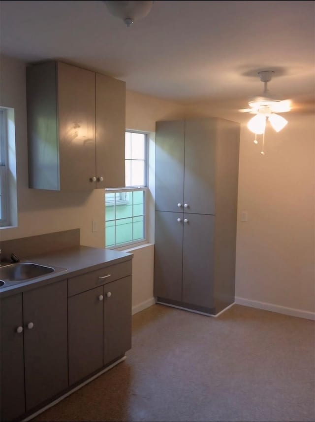 1204 Johnston St, Houston, TX 77022 - kitchen with ceiling fan and light colored carpet