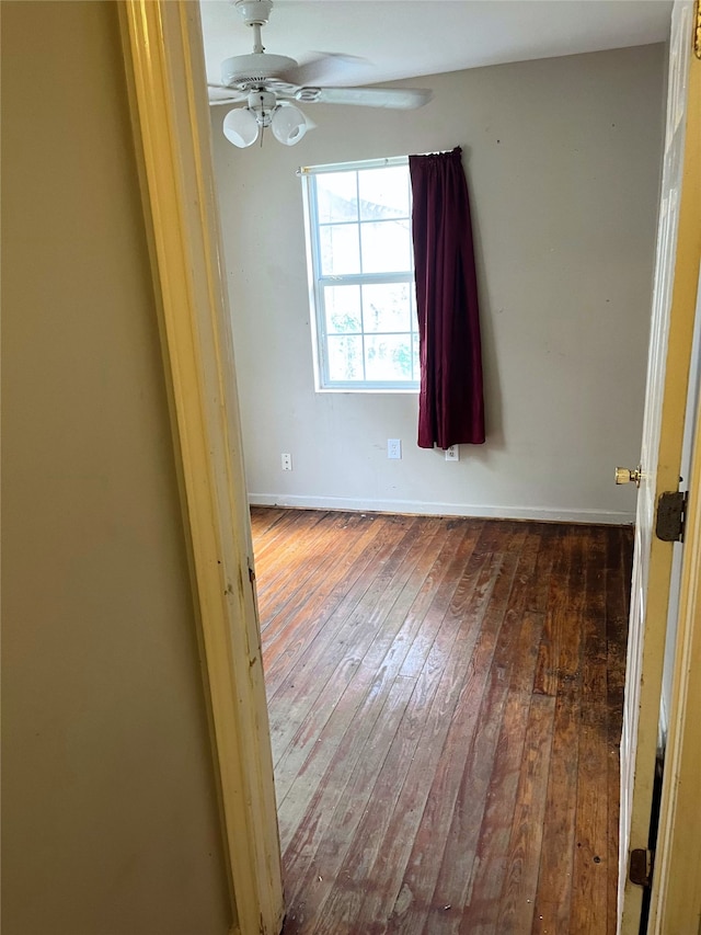 1204 Johnston St, Houston, TX 77022 - empty room with hardwood / wood-style floors and a ceiling fan