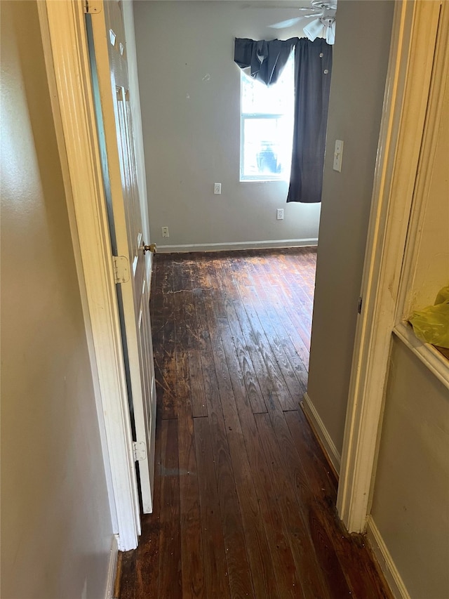 1204 Johnston St, Houston, TX 77022 - corridor featuring dark wood-style floors and baseboards