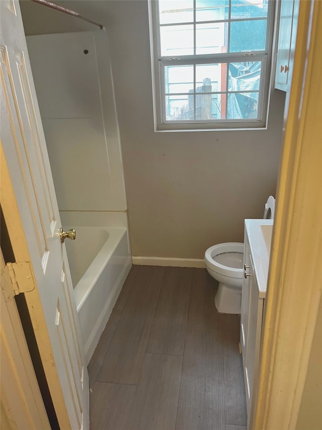 1204 Johnston St, Houston, TX 77022 - bathroom featuring vanity, wood finished floors, and shower / bathtub combination