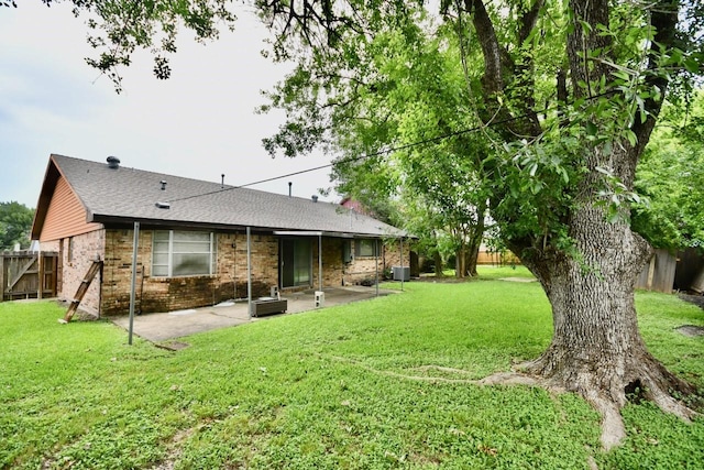 11931 Tanager St, Houston, TX 77072 - back of house with a patio area, brick siding, and a shingled roof