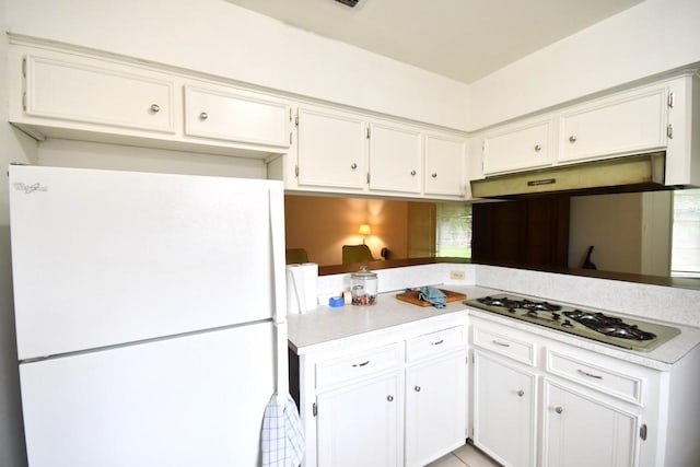 11931 Tanager St, Houston, TX 77072 - kitchen featuring white appliances, under cabinet range hood, white cabinetry, and light countertops