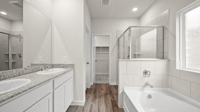 25021 Pomegranate Pl, Montgomery, TX 77316 - full bath featuring a stall shower, a bath, a walk in closet, double vanity, and recessed lighting