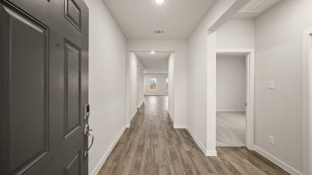 25021 Pomegranate Pl, Montgomery, TX 77316 - hallway featuring wood finished floors