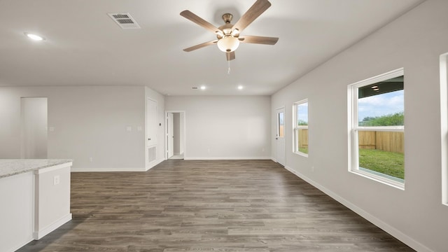 25021 Pomegranate Pl, Montgomery, TX 77316 - unfurnished living room featuring ceiling fan, dark wood-style floors, and recessed lighting