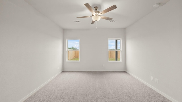 25021 Pomegranate Pl, Montgomery, TX 77316 - carpeted empty room with a ceiling fan, plenty of natural light, and a smoke detector