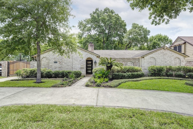918 N Wilcrest Dr, Houston, TX 77079 - ranch-style house with a gate, a chimney, and brick siding