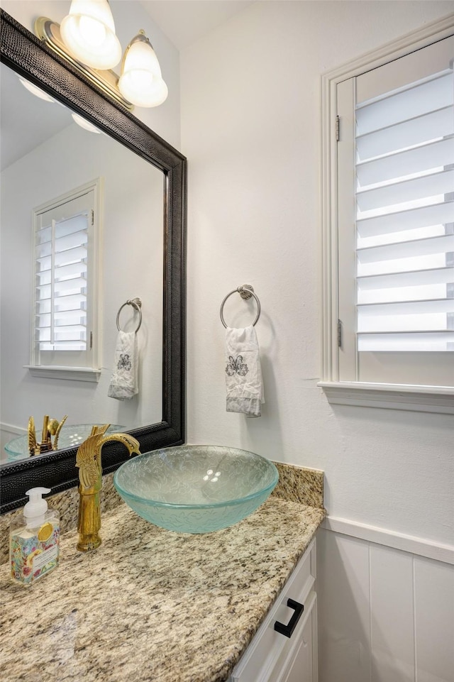 918 N Wilcrest Dr, Houston, TX 77079 - bathroom featuring vanity and wainscoting
