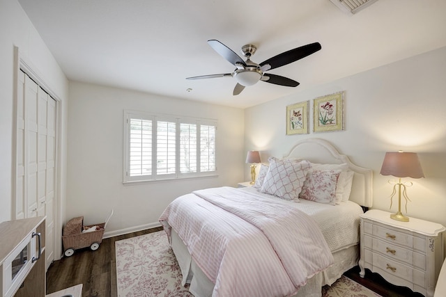 918 N Wilcrest Dr, Houston, TX 77079 - bedroom with a closet, dark wood-style floors, and ceiling fan