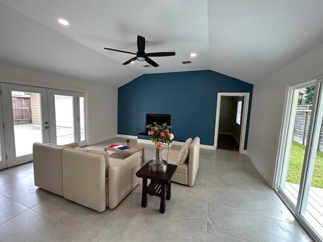 1635 Chippendale Rd, Houston, TX 77018 - living room with lofted ceiling, a ceiling fan, french doors, and recessed lighting