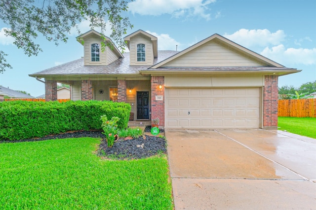 703 Rock Creek Ct, Rosenberg, TX 77469 - view of front facade featuring brick siding, covered porch, driveway, a garage, and roof with shingles