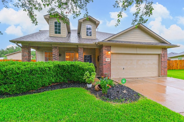 703 Rock Creek Ct, Rosenberg, TX 77469 - view of front of home with brick siding, an attached garage, and driveway